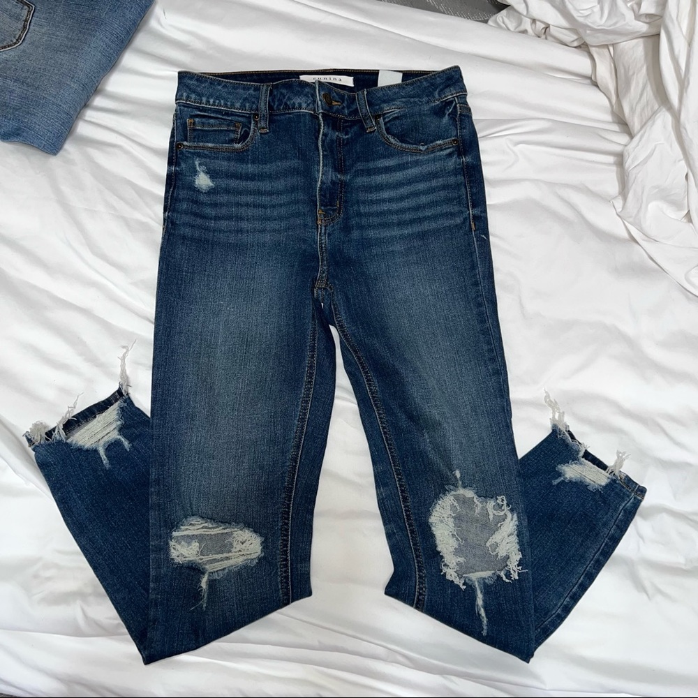 High rise destroyed denim